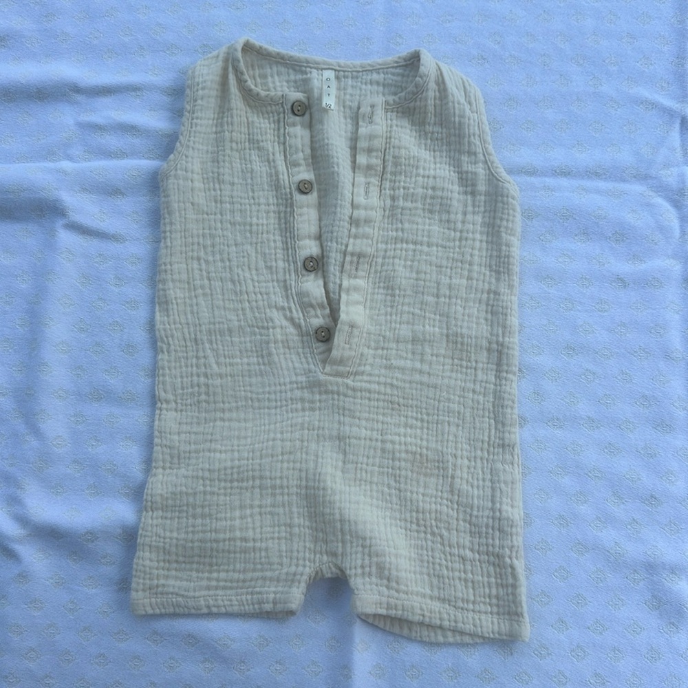 Oat Co. muslin romper in the color ecru
